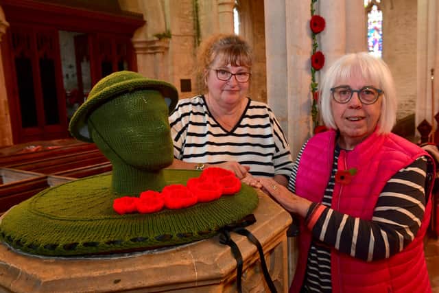 Rauceby WI members, from left - Sam Horton (secretary) and Sue Clark (president) with their knitted soldier's head in the Rauceby Remembers display.
