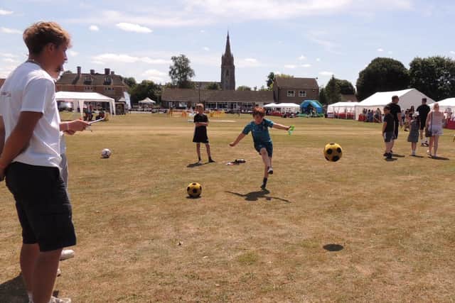 Having a go at the football darts game.