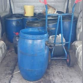 The 12 container drums police found in the back of the van.