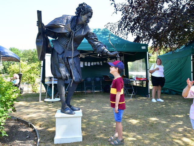 Seven-year-old Isaac Bouic, of Horsington, has a bit of fun with a 'living statue' performer at the Woodhall Spa festival.