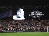 The LED board shows a photo Queen Elizabeth II as players of West Ham United and FCSB observe a minutes silence after it was announced that Queen Elizabeth II has passed away during the UEFA Europa Conference League group B match between West Ham United and FCSB at London Stadium on September 08, 2022 in London, England. (Photo by Richard Heathcote/Getty Images)