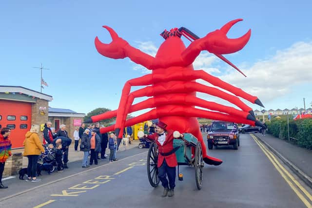 An giant inflatable red lobster took part in the Carnival Parade. Photo by Chris Frear