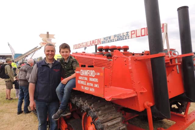 Trade exhibitor Robert Crawford and son Robert with the old Sherman tank bought by his grandfather in 1947 which he converted into a crawler tractor for ploughing.