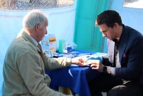 Steve Roest conducting a heart health test at a Lincolnshire Co-op health pod event