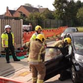 A car crash rescue demonstration by the on-call fire crew and ambulance medics.