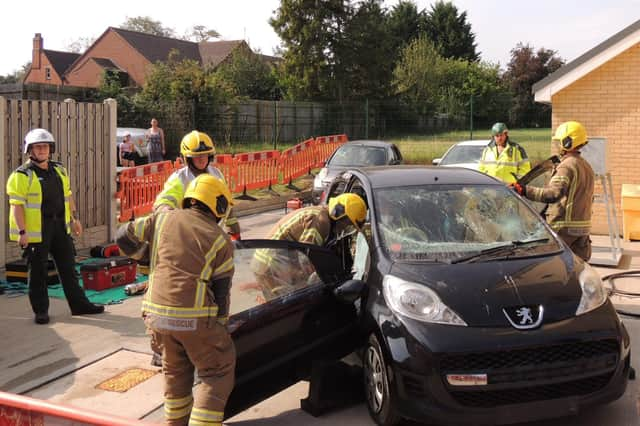 A car crash rescue demonstration by the on-call fire crew and ambulance medics.