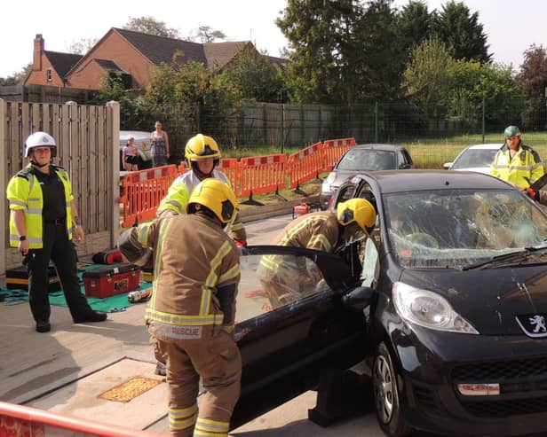A car crash rescue demonstration by the on-call fire crew and ambulance medics.