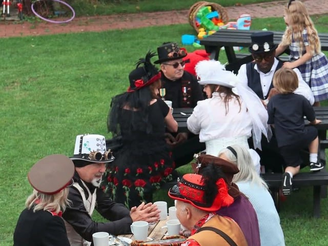 Alice Steampunks enjoying a Picnic at The Unbirthday table