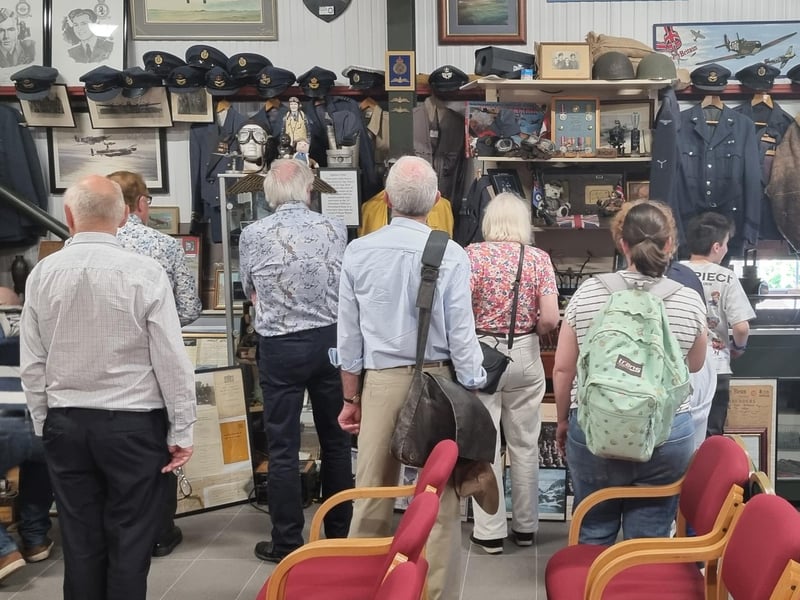 The international visitors to Freiston Shore's We'll Meet Again exploring the museum.