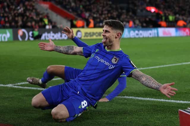 Gavan Holohan celebrates for Grimsby Town in the FA Cup at Southampton in 2023.