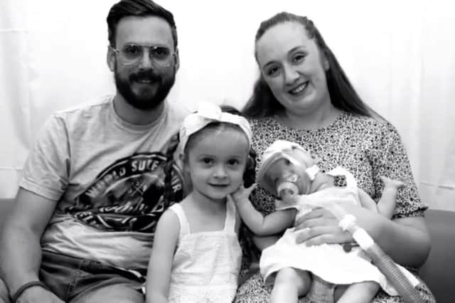 Little Dottie Harrison who sadly died just days before her first birthday pictured with her family.