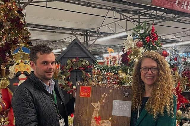 Ingrid Ashton from Lincoln and Lindsey Blind Society receives the reindeer from Louth Garden Centre manager Ashley Reeson.