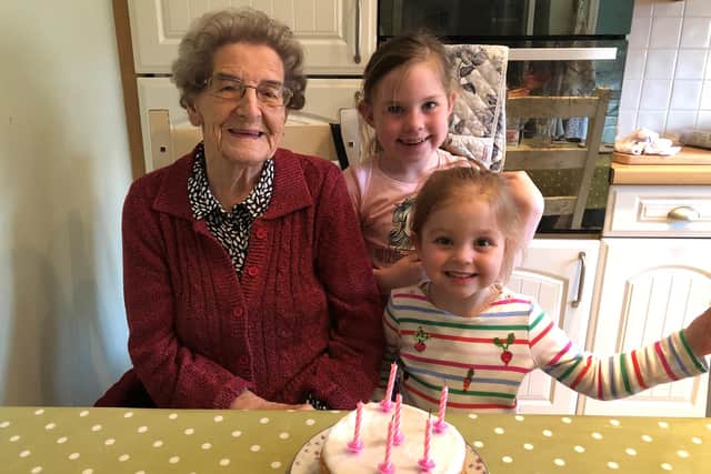 Scarlett, centre, with her great grandma Nora and sister Erin