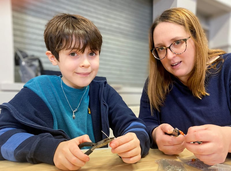 Aubry and Mum Helen Bird at the Jewellery repair table. 
Photo by Chris Frear