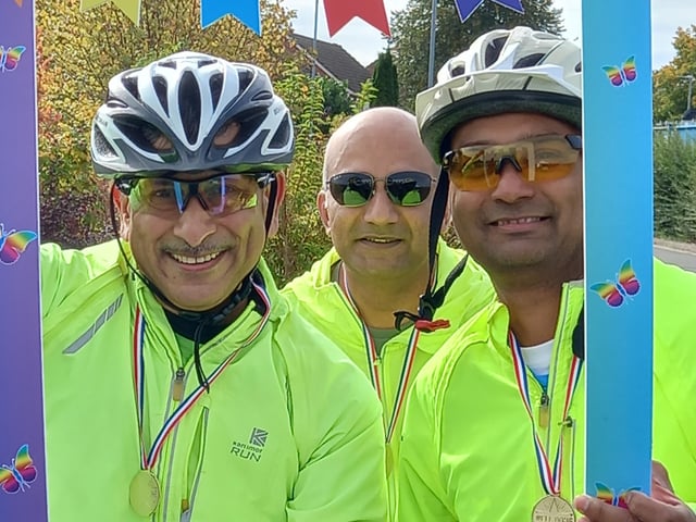 VShreeji Brahmbhatt, Vijayendra Waykar, and Ravindranath Sant prepare to take on the bike ride.