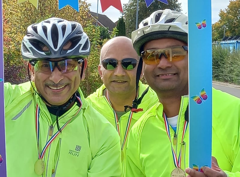 VShreeji Brahmbhatt, Vijayendra Waykar, and Ravindranath Sant prepare to take on the bike ride.