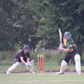 Player of the Match Connor Parsons batting for the Guest XI with Jonny Clark of Horncastle wicket keeping