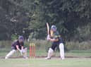 Player of the Match Connor Parsons batting for the Guest XI with Jonny Clark of Horncastle wicket keeping