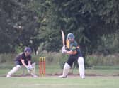 Player of the Match Connor Parsons batting for the Guest XI with Jonny Clark of Horncastle wicket keeping