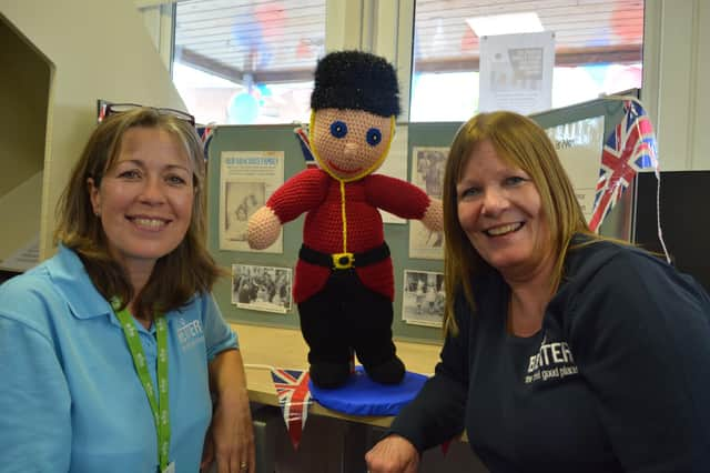 Kay Turnbull and Mel Fenwick with a woolly  visitor