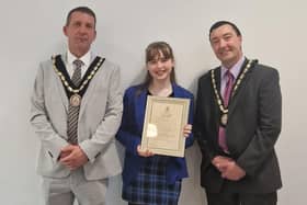 Summer Willetts receiving her community award with Mayor of Skegness Coun Adrian Findley (left) and Deputy Mayor Coun Jimmy Brookes.