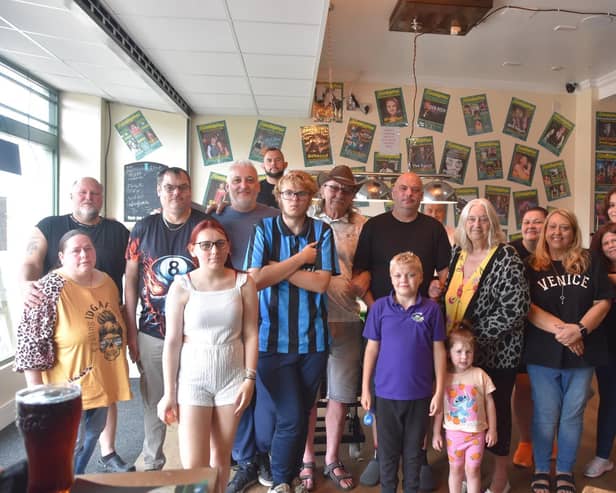 On cue - Dave Morton (in black, centre) pictured with his support team.