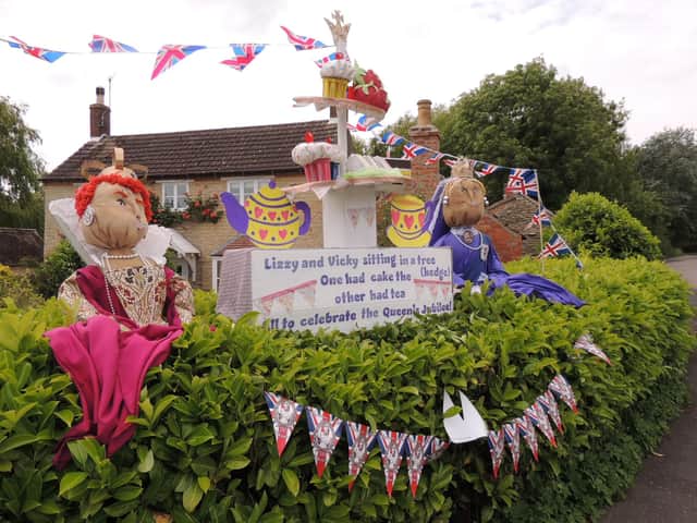 Royal scarecrows - the two Queen Elizabeths in the jubilee Leasingham scarecrow trail, created by Kaye Bristow.