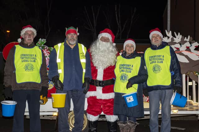 Lions Left to right- Chris Capes, Nigel Peart, Neal Marshall (santa), Judy Gibbons, Jeff Pitcock on the sleigh route in Coningsby.