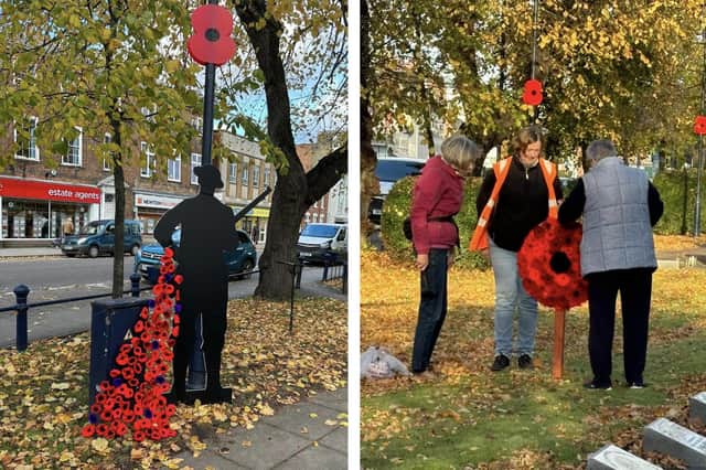 The 'Tommy' soldier left, and volunteers erecting poppy displays produced by members of Boston Men's Shed.