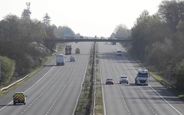 Cars make their way along the M3 motorway near to Fleet in Hampshire, as the UK continues in lockdown to help curb the spread of the coronavirus.