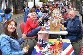 Cheers to the new King - the street party in Spilsby gets underway.