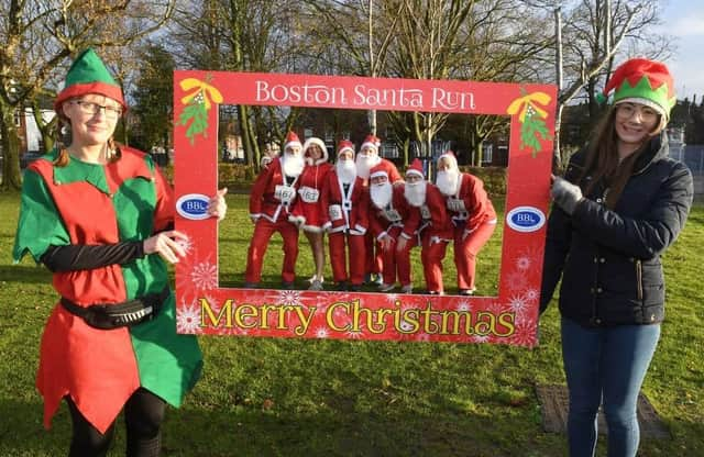 Santas enjoy an 'Elfie Selfie' at the start of last year's Santa Run in Boston.