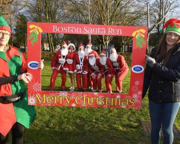 Santas enjoy an 'Elfie Selfie' at the start of last year's Santa Run in Boston.