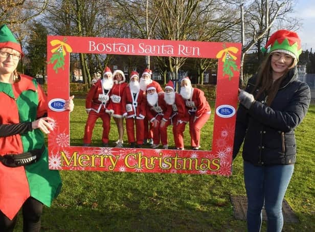 Santas enjoy an 'Elfie Selfie' at the start of last year's Santa Run in Boston.