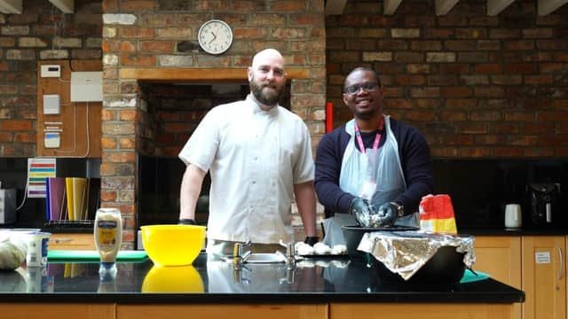 Chef Darren Hampton (left) of Home From Home Care leading cooking workshops for staff.