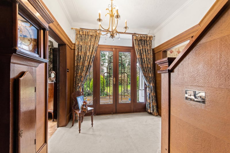 The entrance hall, with the original art deco design on the door.