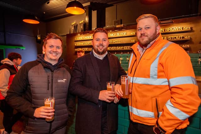 Mike Bingham, Ben Chapman and Josh Chapman enjoying a drink at Tap on the Line.