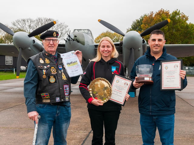 Winners of the day - (from left) Matt Chapman, who is a member of the East Midlands RBL riders, with a raffle first prize for a Lancaster taxi run; and collectors Gill Hodgson of the Woodhall Spa branch with the the Shepherd Poppy Trophy, and Sean Ashton, of Barton on Humber, with the Stella Willing Rose Bowl for a poppy appeal organiser without a branch, .