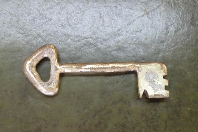 A brass replica of the key found in excavations at Sleaford castle site.