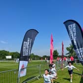 A team crossing the finish line of the 2024 Oundle Schools Triathlon