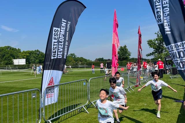 A team crossing the finish line of the 2024 Oundle Schools Triathlon