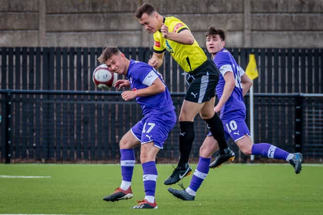 Gainsborough Trinity new-boy Charlie Jemson battles for a header while playing for Worksop Town.