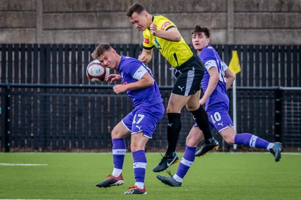 Gainsborough Trinity new-boy Charlie Jemson battles for a header while playing for Worksop Town.