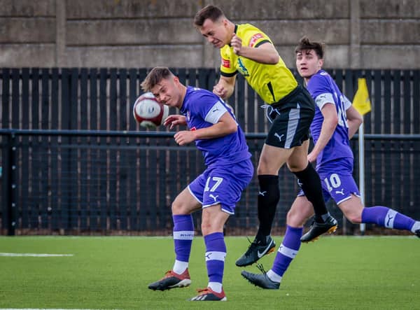 Gainsborough Trinity new-boy Charlie Jemson battles for a header while playing for Worksop Town.