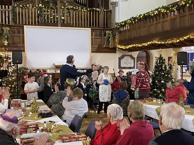 Pastor Sue Alldread addressing guests at the Wainfleet Methodist Church Community Meal.