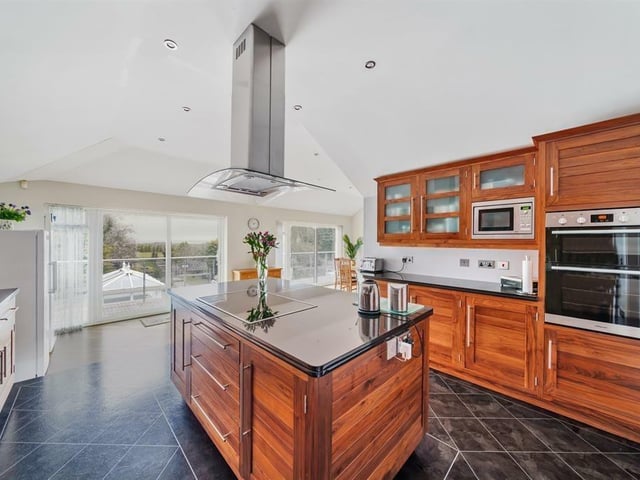 A closer look at the kitchen, with balcony in the distance.