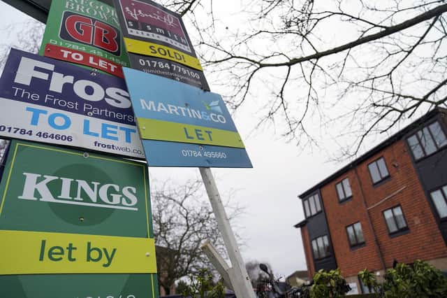 A general view of estate agent boards outside a property in Staines-upon-Thames in Surrey. Picture date: Monday January 10, 2022.