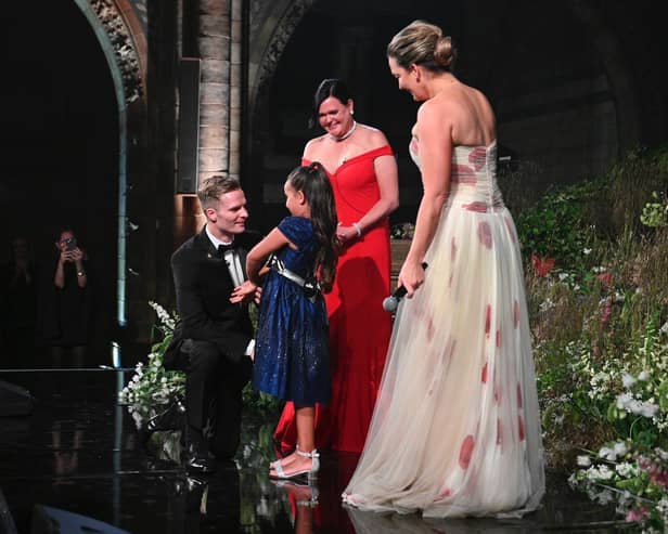 Robert Brookes meets little Demi, 7, her mum Dee Dee and CEO of DKMS.