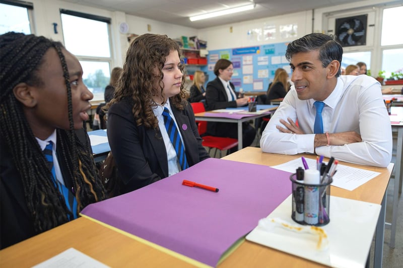 Mr Sunak talking to pupils.