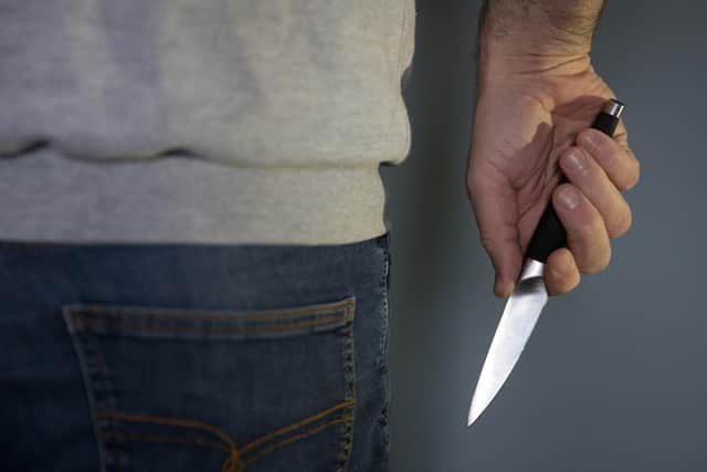 A model poses holding a knife. PA Photo. Picture date: Thursday January 16, 2020. Photo credit should read: Andrew Matthews/PA Wire